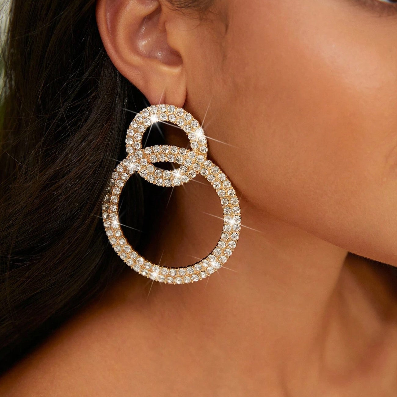 Earrings with sparkling stone inlays