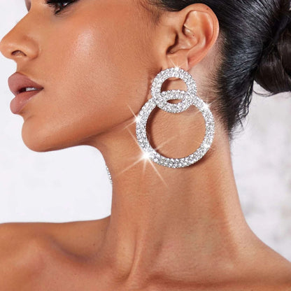 Earrings with sparkling stone inlays