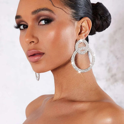 Earrings with sparkling stone inlays