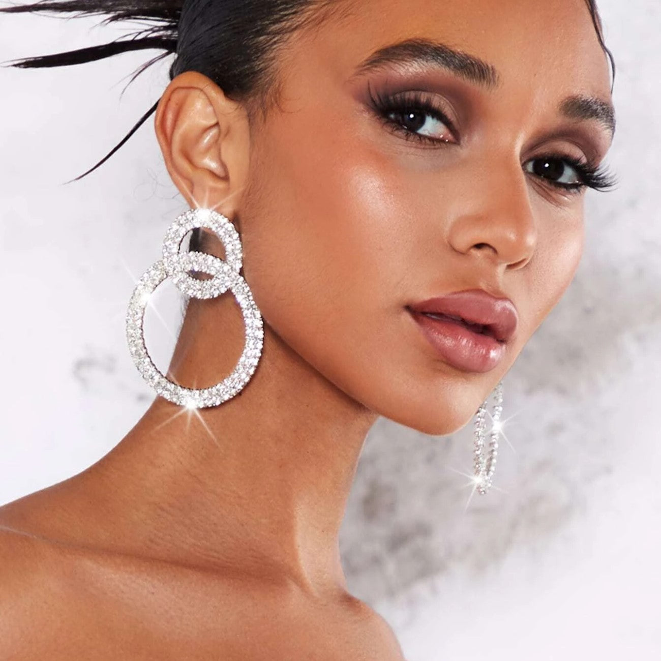 Earrings with sparkling stone inlays