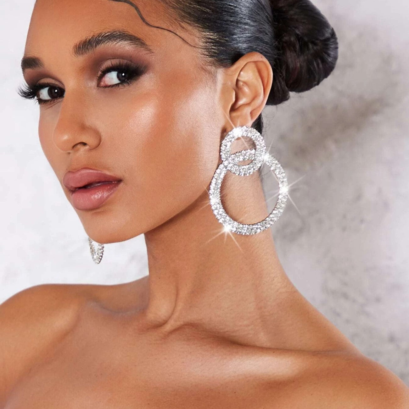 Earrings with sparkling stone inlays