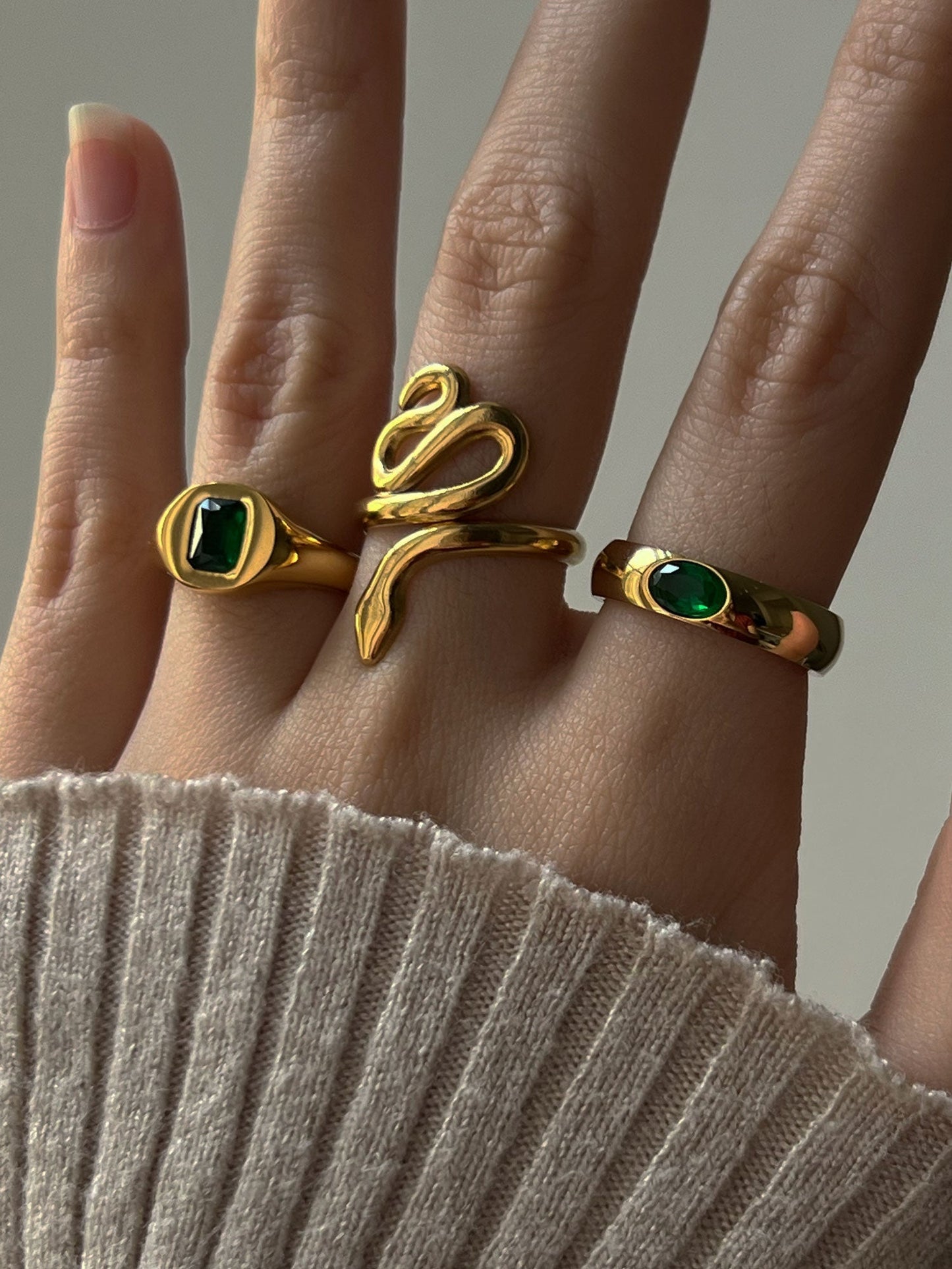 Gold Ring with Embedded Emerald Gemstone