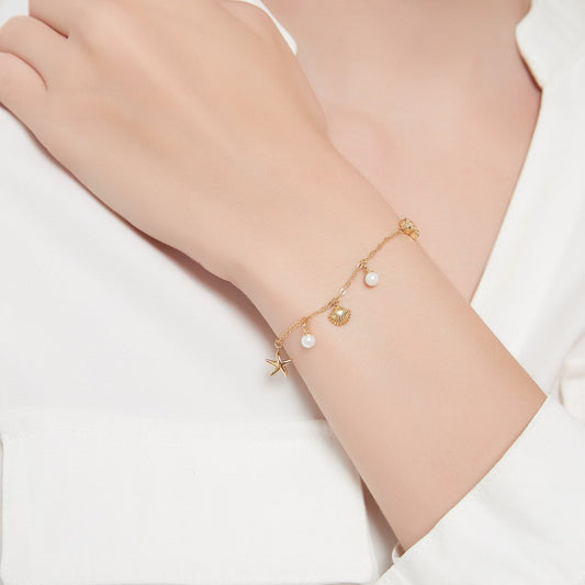 Bracelet with shell and starfish charm
